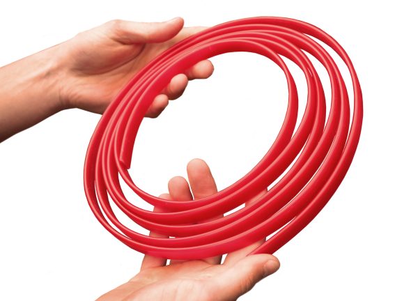 Super Rod Cable Tongue tool - coiled tool being held in a persons hands