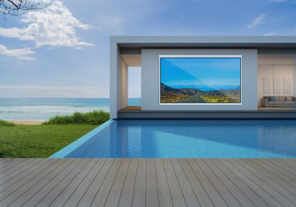 Aquavision Horizon outdoor TV hanging in an alcove beside a pool