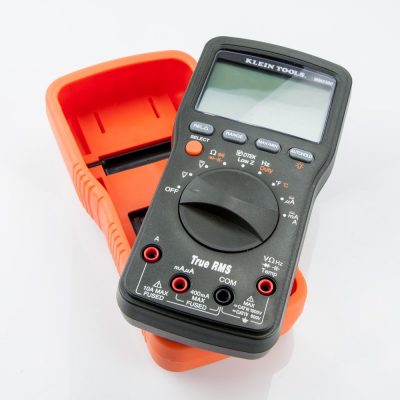 Klein Tools Multimeter MM2300 - tool at an angle on top of the hard casing tool cover.