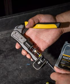 KLEIN TOOLS Heavy-Duty Multi-Connector Compression Crimper - showing someone using the crimper with the tool open about to crimp