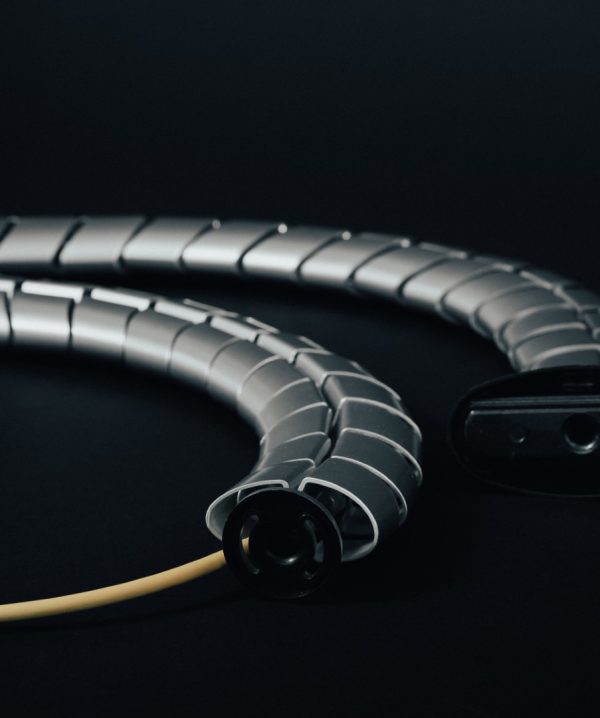 FSR Concertto Slide Cable Management pathway showing aluminium finish and rounded shape of links - shwn with end view with cable running through it.