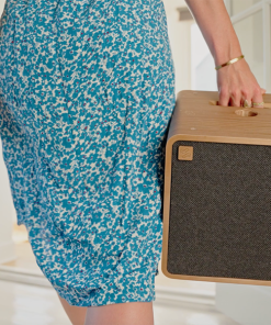 SOWA Sound Wireless Speaker - single SOWA unit being carried by a person holding the inbuilt handle.